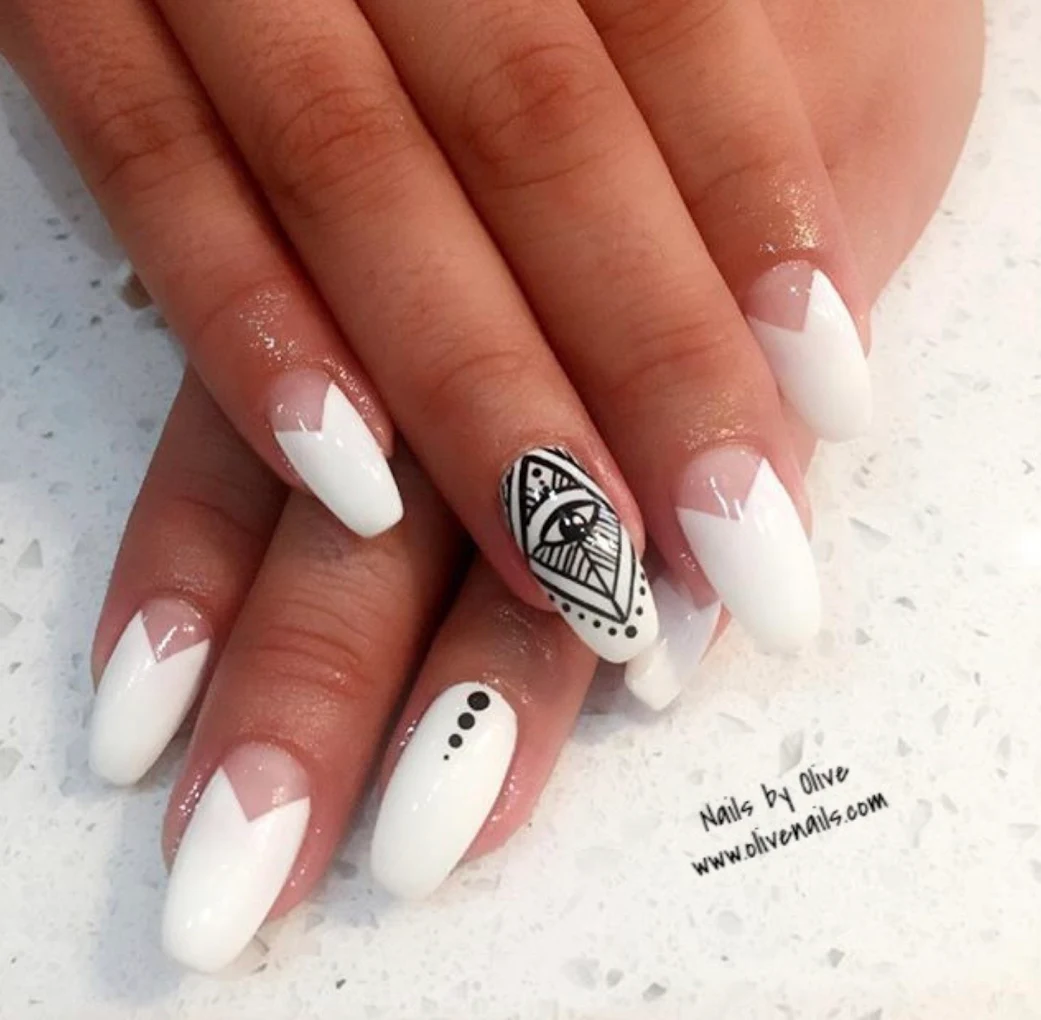 White geometric nail art with eye detail — Olive Nails and Spa