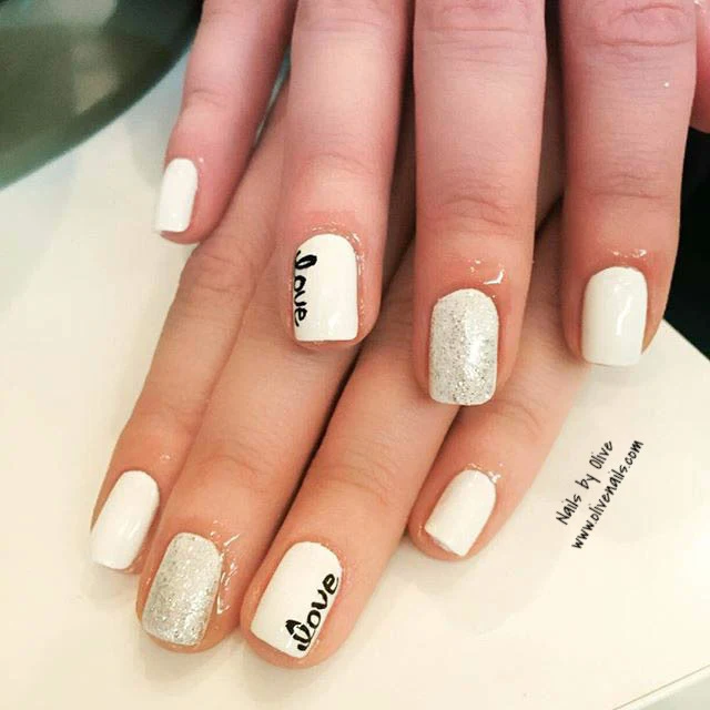 White gel nails with silver glitter and love script art — Olive Nails & Spa, Thornhill
